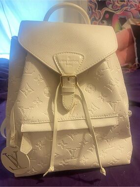 Cream Embossed Monogram Backpack